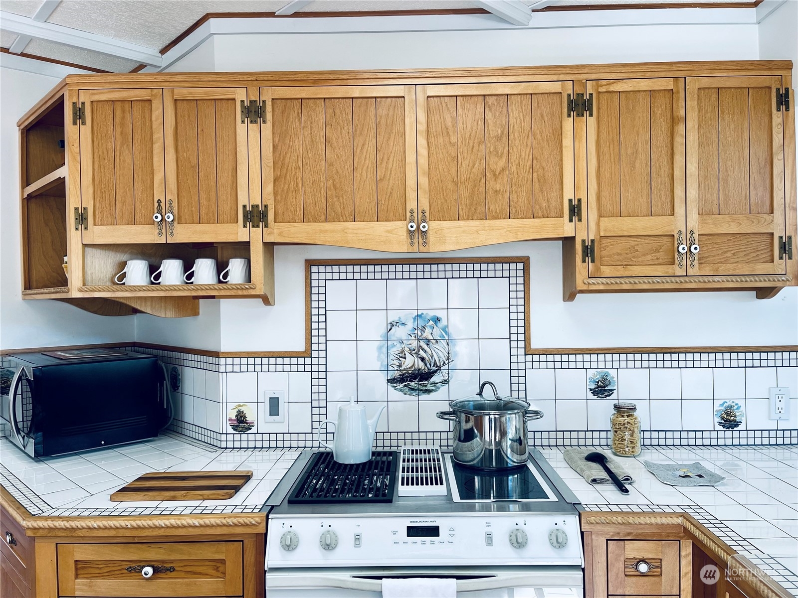 36808 Stackpole Road Oysterville, WA 98641 - Photo 13 of 40 a kitchen with a stove and a cabinets