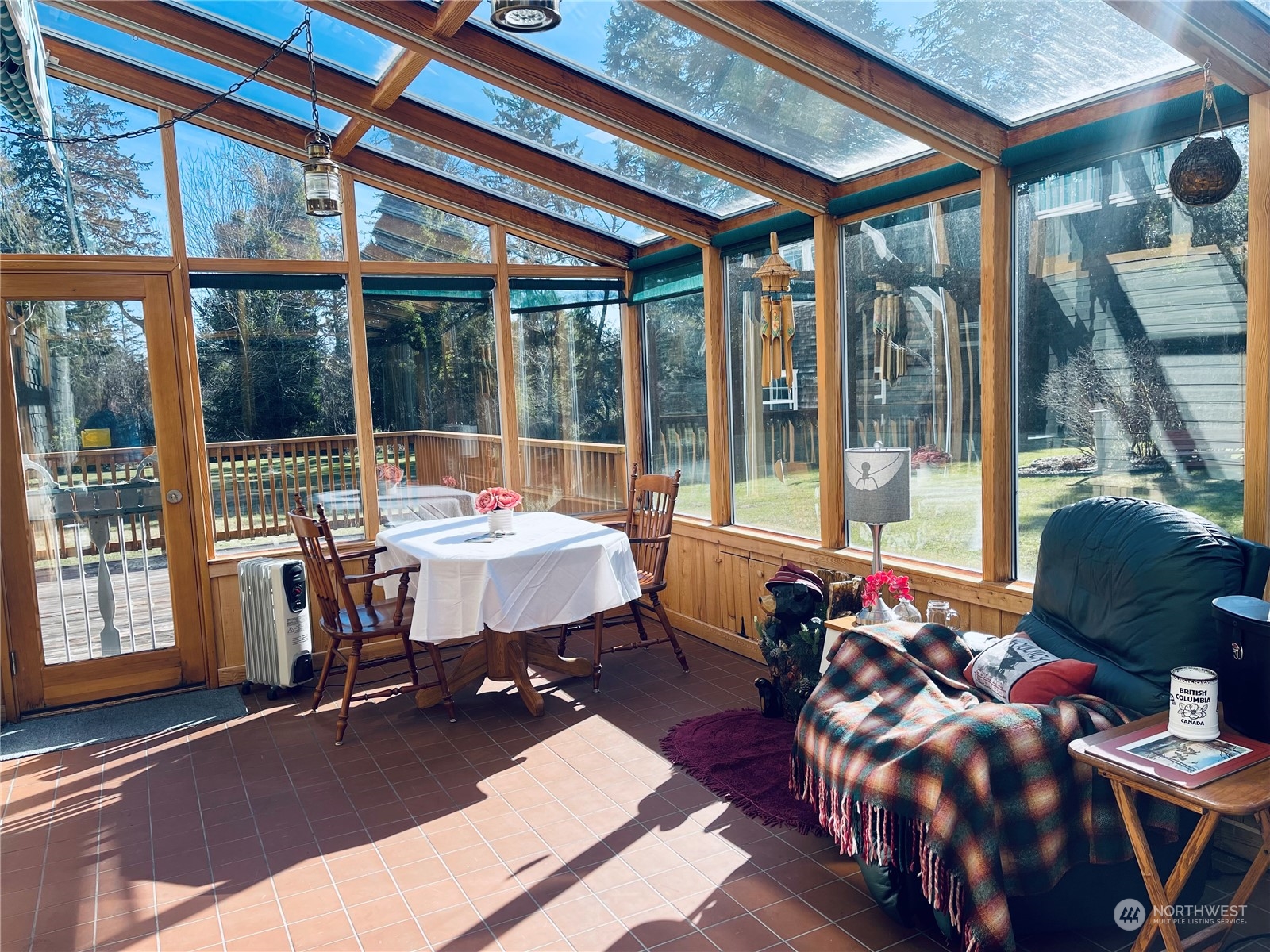 36808 Stackpole Road Oysterville, WA 98641 - Photo 15 of 40 a living room with furniture and a floor to ceiling window