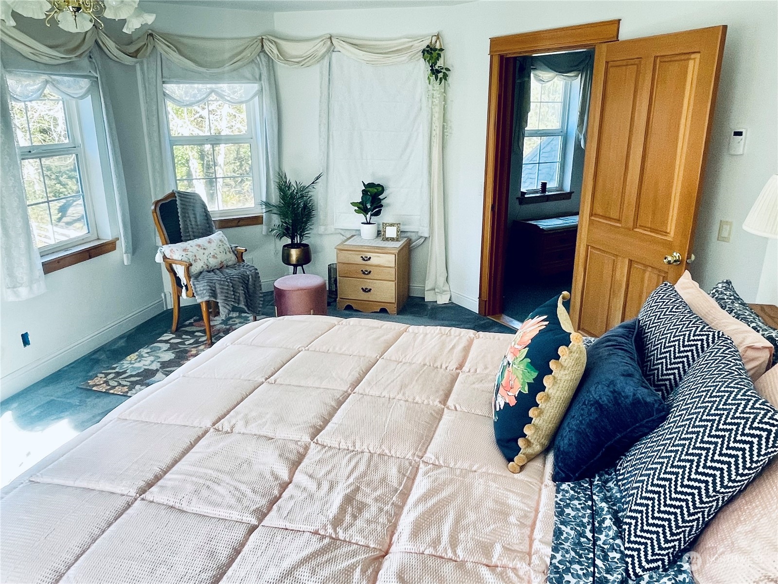 36808 Stackpole Road Oysterville, WA 98641 - Photo 19 of 40 a bedroom with a bed a window and walk in closet