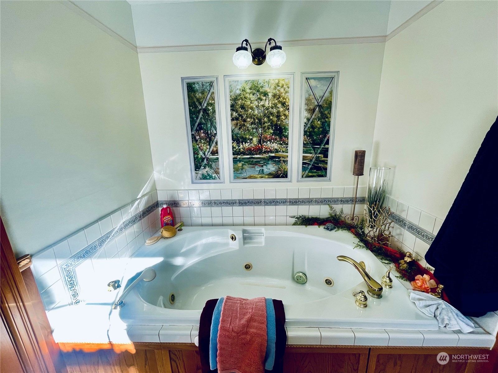 36808 Stackpole Road Oysterville, WA 98641 - Photo 21 of 40 a bathroom with a tub and a window
