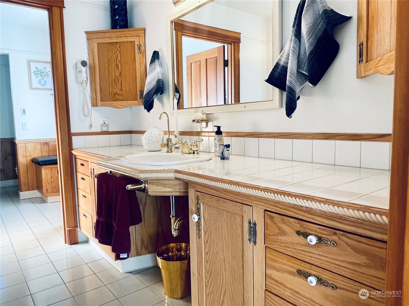 36808 Stackpole Road Oysterville, WA 98641 - Photo 22 of 40 a bathroom with a sink and a mirror