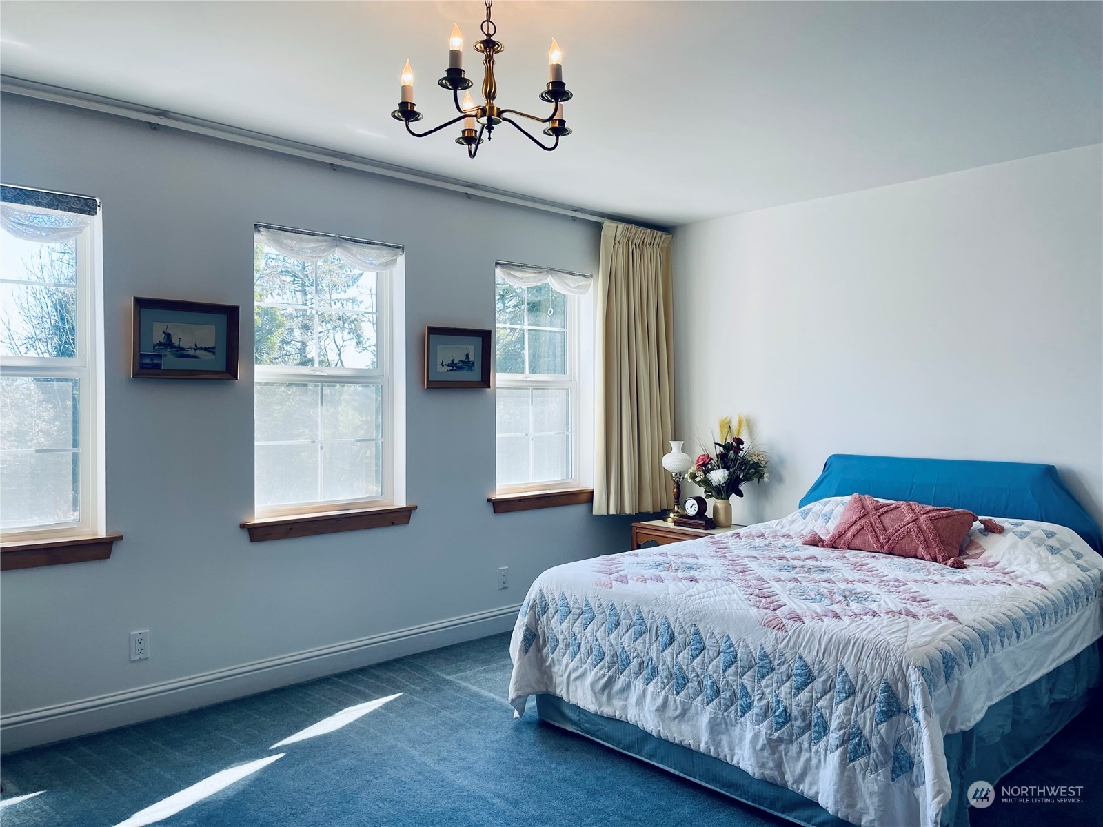 36808 Stackpole Road Oysterville, WA 98641 - Photo 24 of 40 a bedroom with a large bed and a window