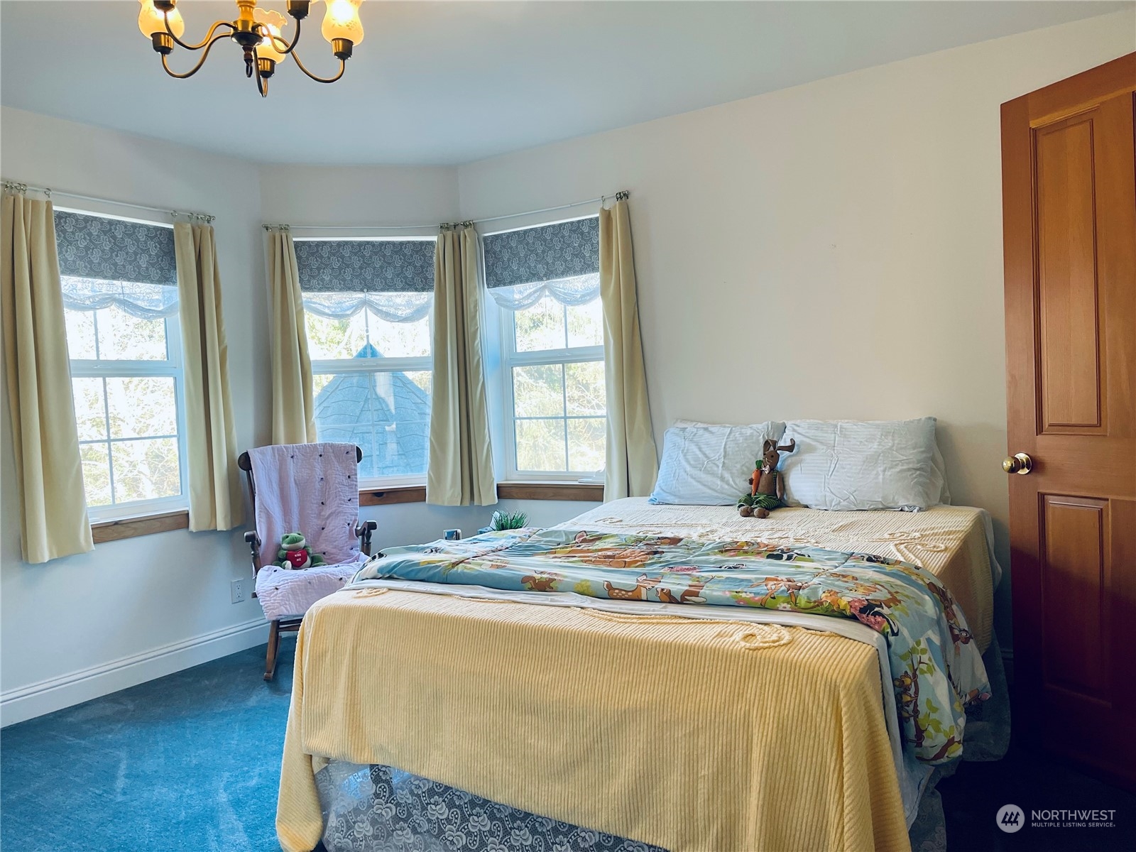 36808 Stackpole Road Oysterville, WA 98641 - Photo 26 of 40 a bed sitting in a bedroom next to a window