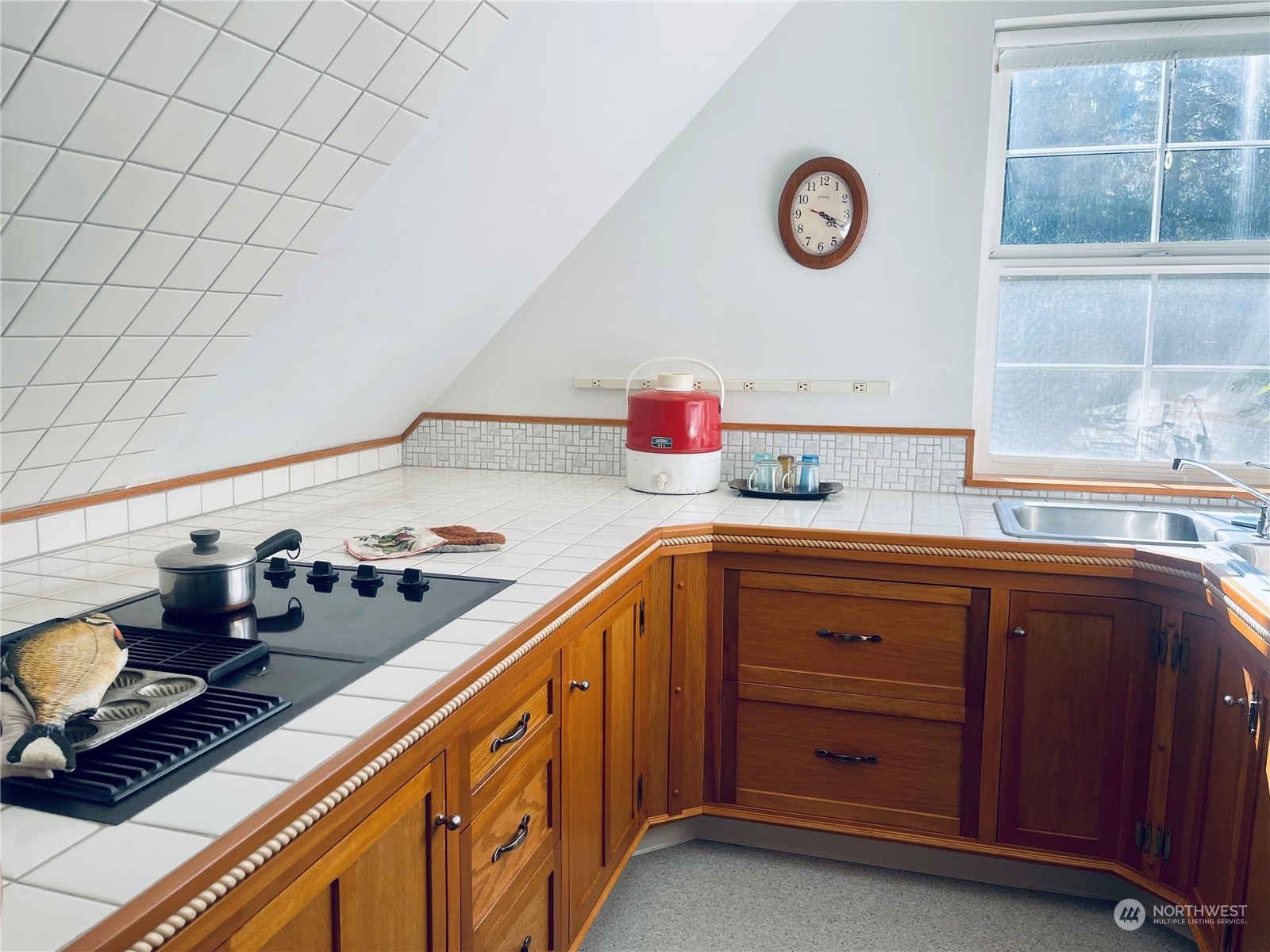 36808 Stackpole Road Oysterville, WA 98641 - Photo 31 of 40 a kitchen with sink cabinets and stove