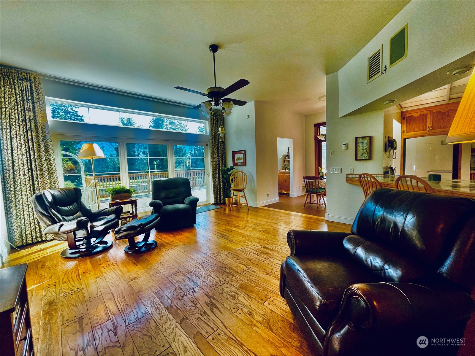 36808 Stackpole Road Oysterville, WA 98641 - Photo 9 of 40 a living room with furniture and a chandelier