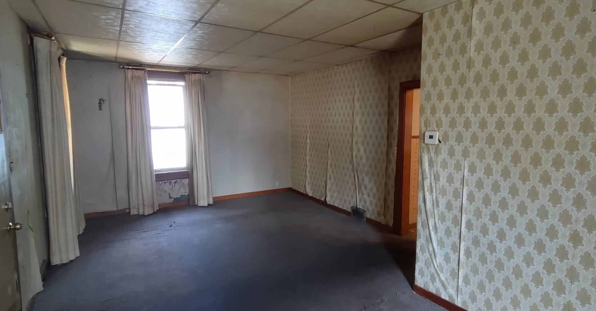 227 Ave C Rochelle, IL 61068 - Photo 27 of 36 a view of a hallway with wooden shelves