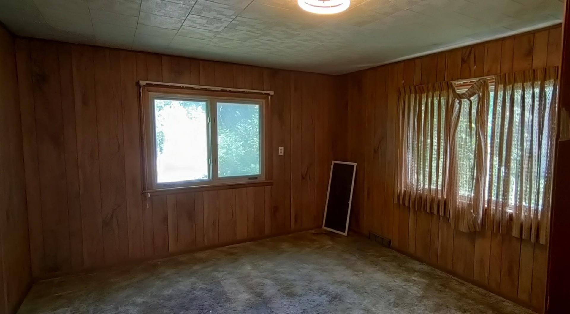 227 Ave C Rochelle, IL 61068 - Photo 5 of 36 an empty room with windows