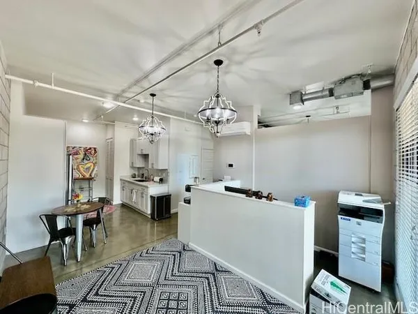 a kitchen that has a lot of cabinets in it