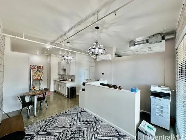 a kitchen that has a lot of cabinets in it