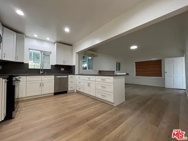 a large kitchen with cabinets