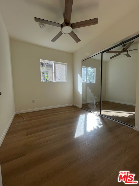 1530 5th Avenue Los Angeles, CA 90019 - Photo 6 of 9 a view of empty room with wooden floor