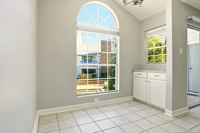 a kitchen with a sink cabinets and window