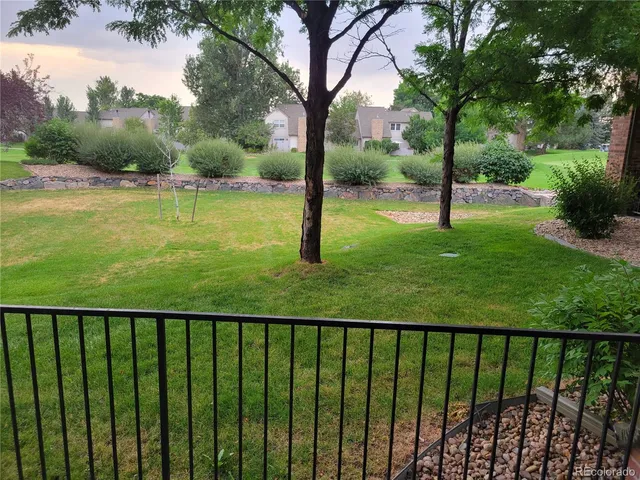 a view of a garden and deck