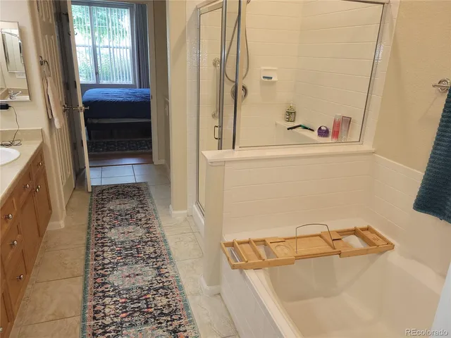 a bathroom with a bathtub and a shower