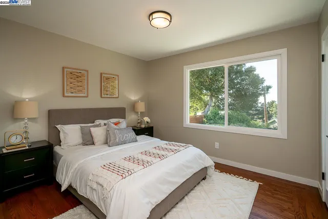 a bed room with a bed and a window