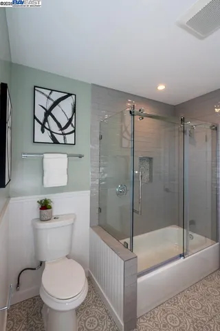 a bathroom with a shower and a toilet