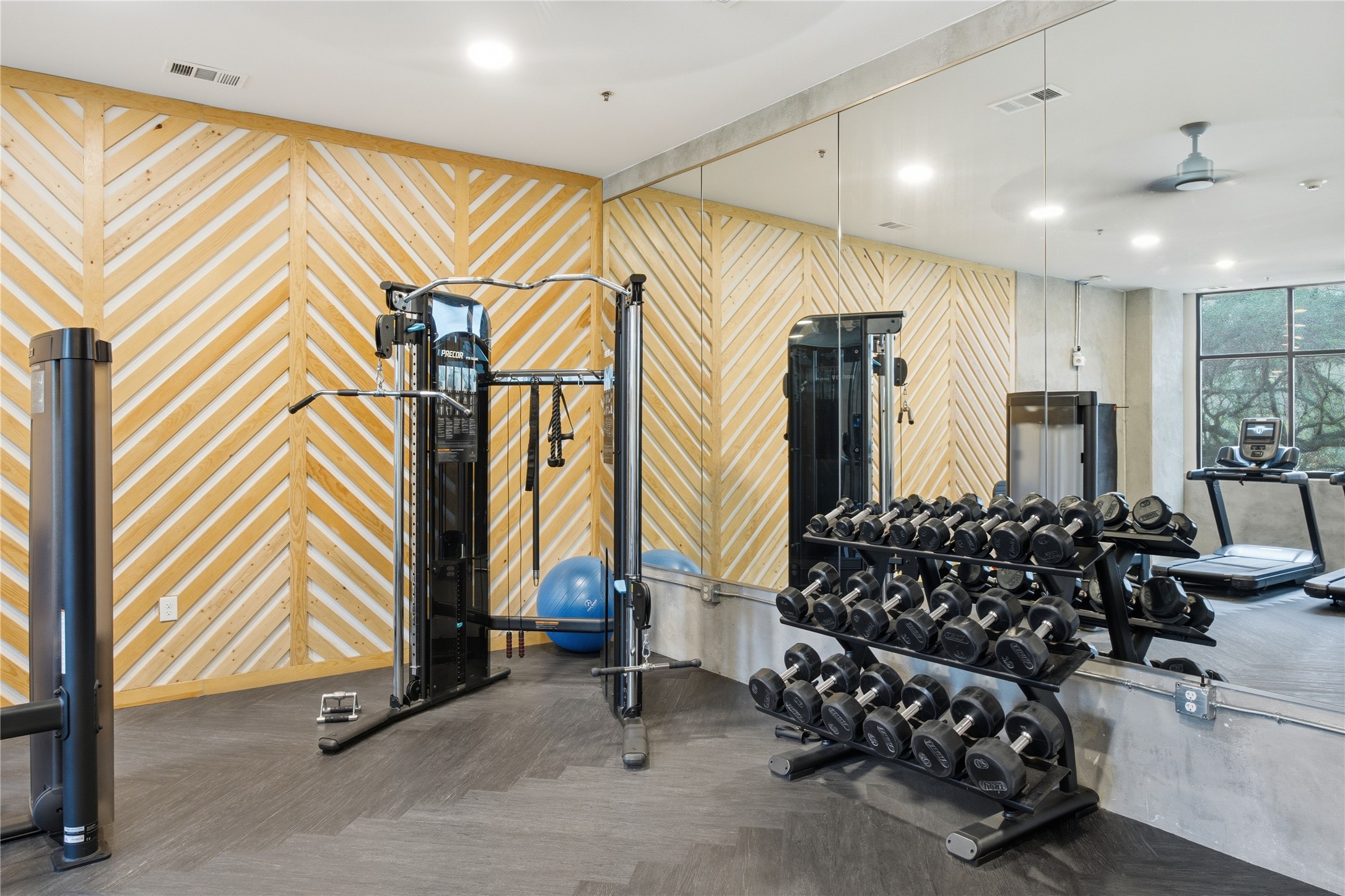 2500 Longview Street, Unit 219 Austin, TX 78705 - Photo 35 of 40 Gym with recessed lighting, a ceiling fan, and wooden walls