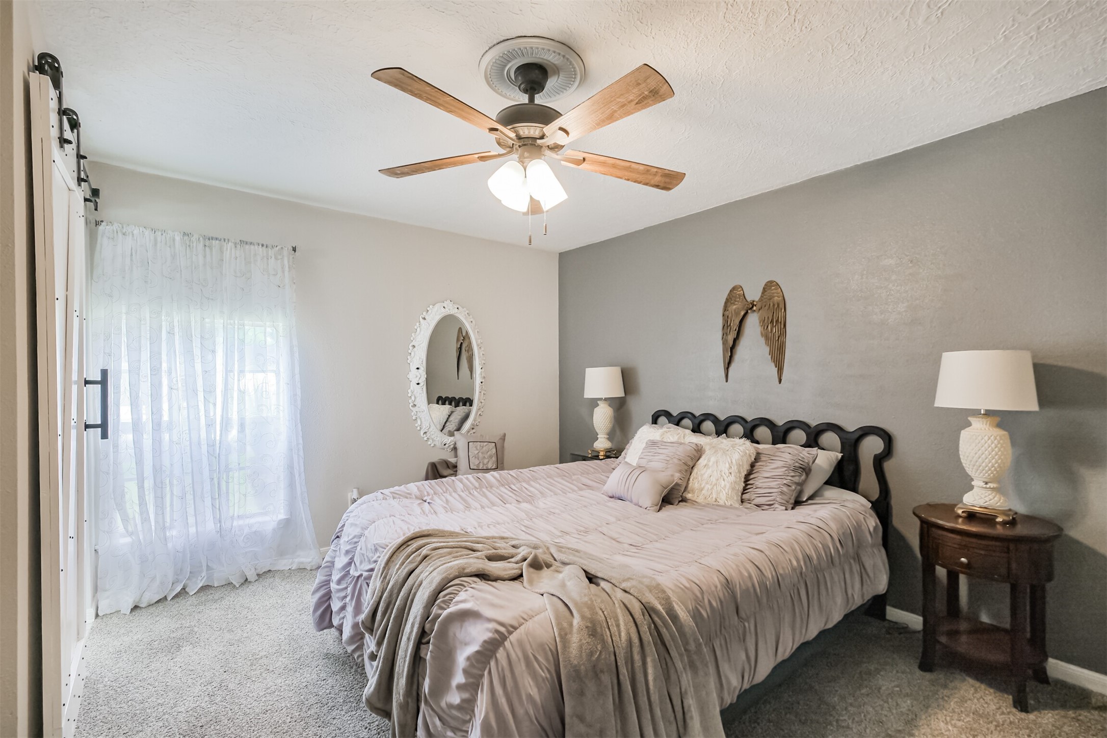 2705 Parrott Avenue Rosenberg, TX 77471 - Photo 17 of 37 a bedroom with a bed and a chandelier
