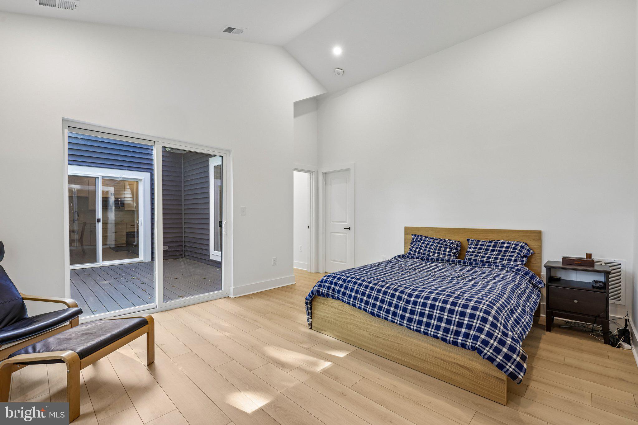 4315 Pinetree Road Rockville, MD 20853 - Photo 13 of 28 a bedroom with a bed and wooden floor