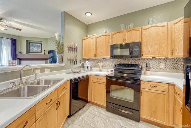 a kitchen with a sink stove and microwave