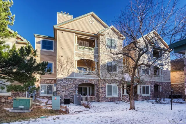 a view of a building with a yard