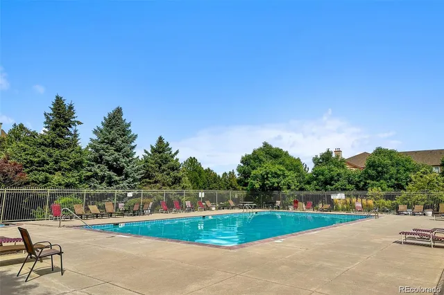 a view of swimming pool with a yard