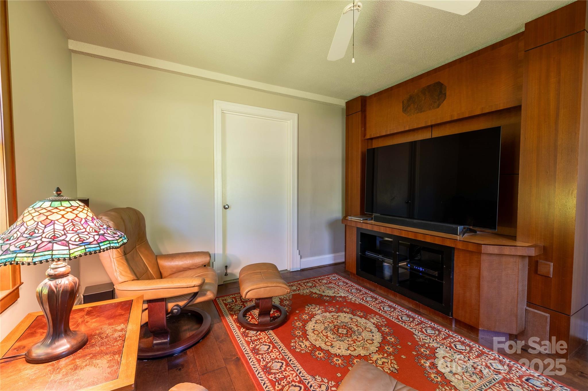 7825 Buck Creek Road Marion, NC 28752 - Photo 15 of 48 a living room with furniture and a flat screen tv