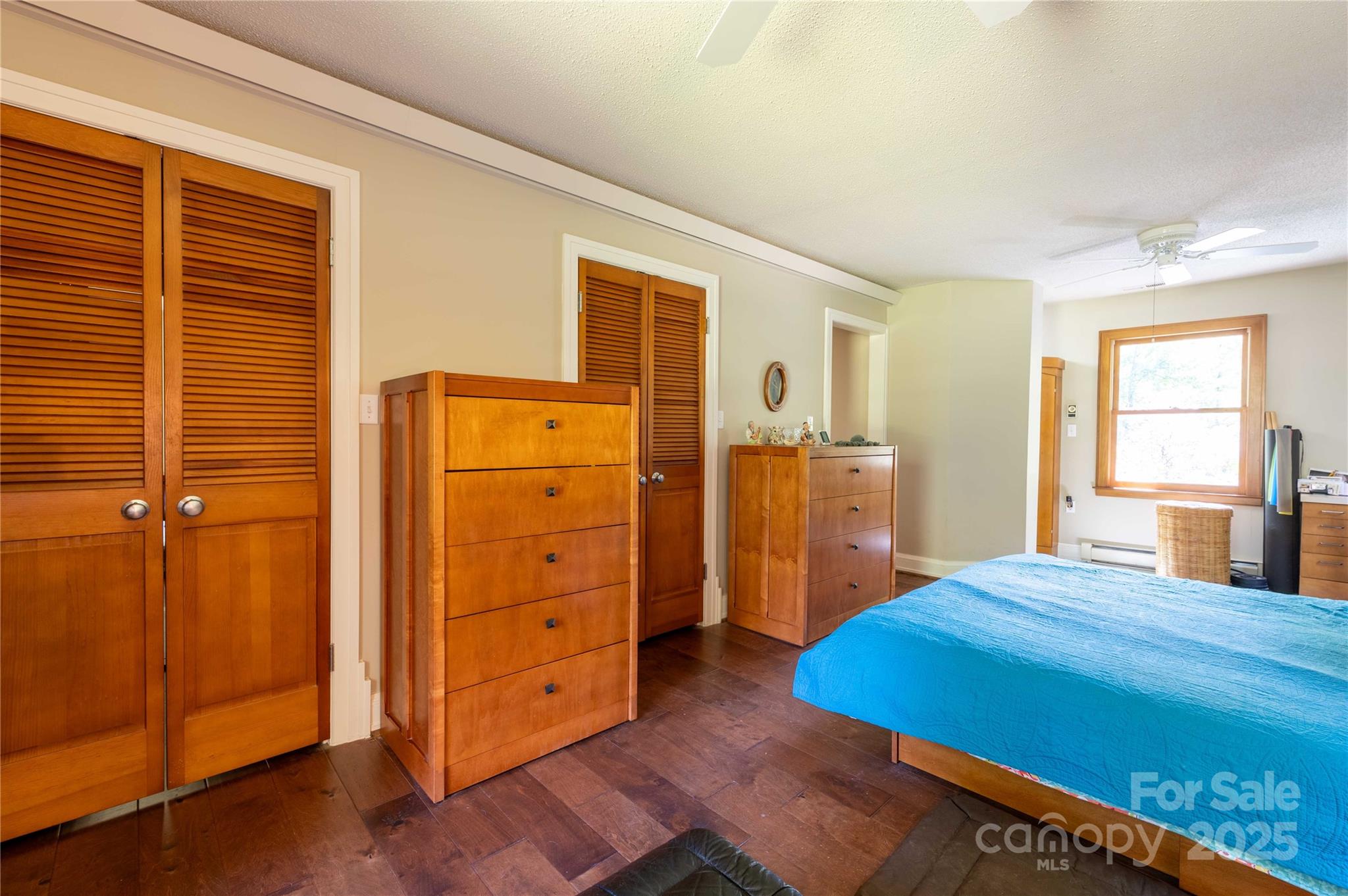 7825 Buck Creek Road Marion, NC 28752 - Photo 25 of 48 a bedroom with a bed and a dresser