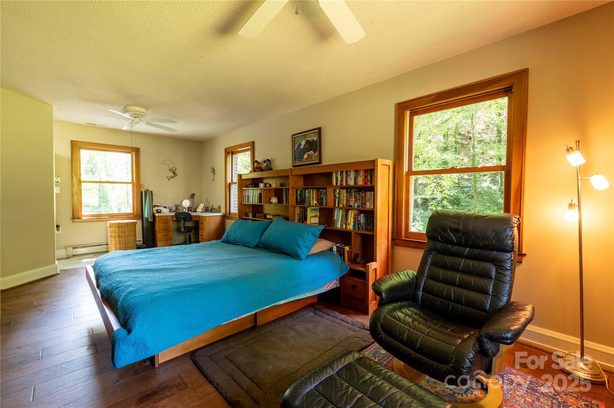 7825 Buck Creek Road Marion, NC 28752 - Photo 27 of 48 a bedroom with a bed and wooden floor