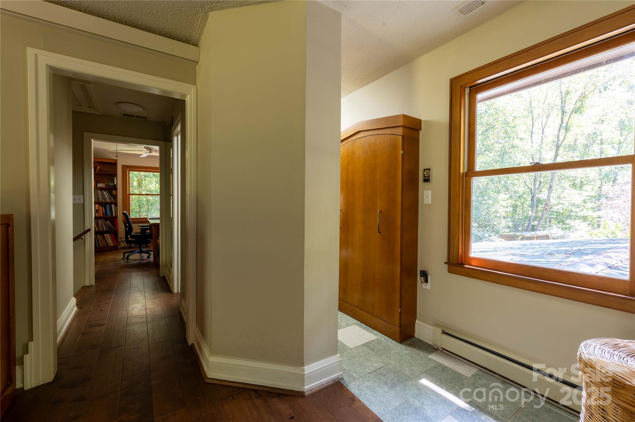 7825 Buck Creek Road Marion, NC 28752 - Photo 29 of 48 a view of a hallway with wooden floor and a mirror