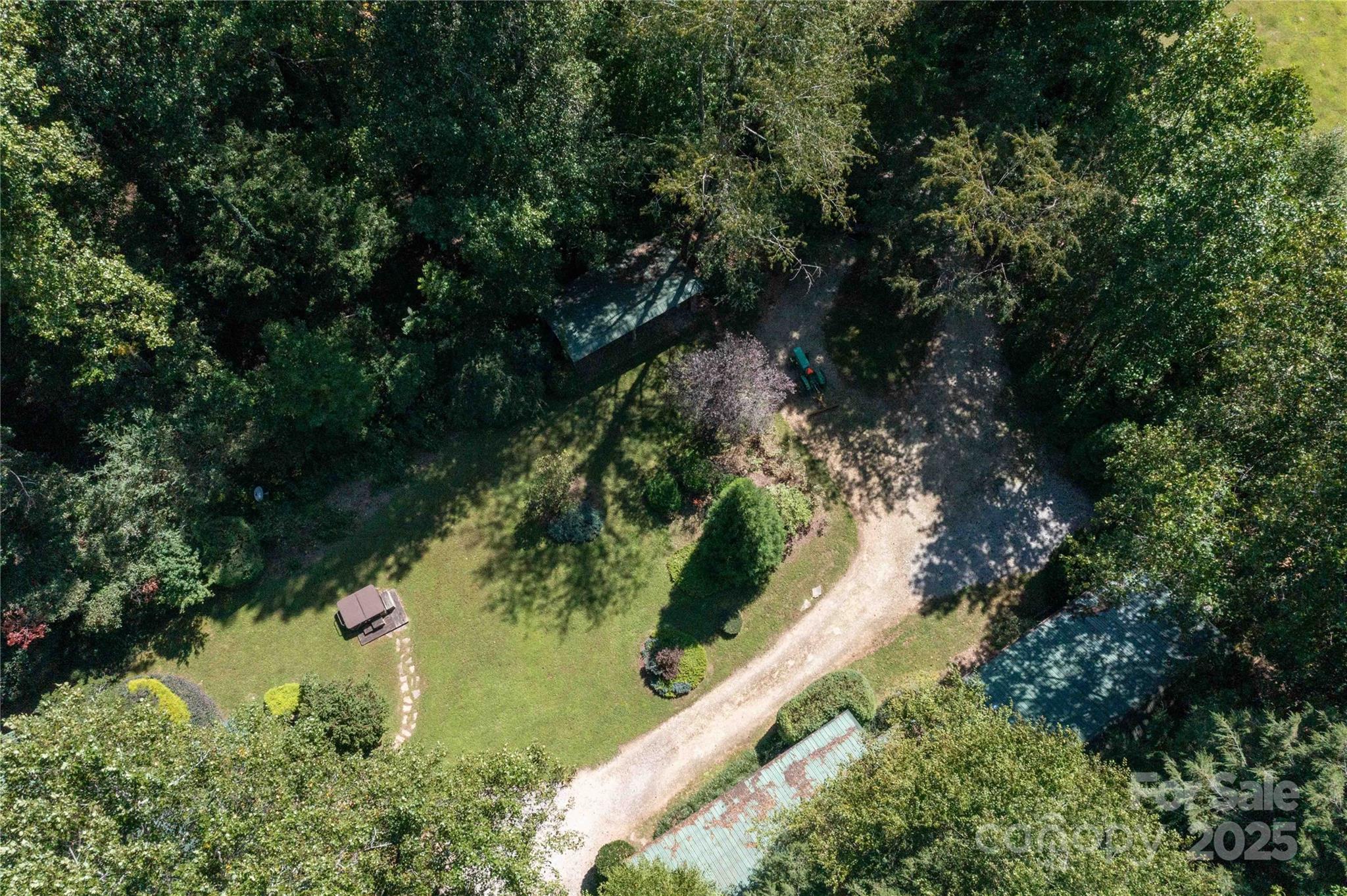7825 Buck Creek Road Marion, NC 28752 - Photo 37 of 48 an aerial view of residential houses with outdoor space and trees all around