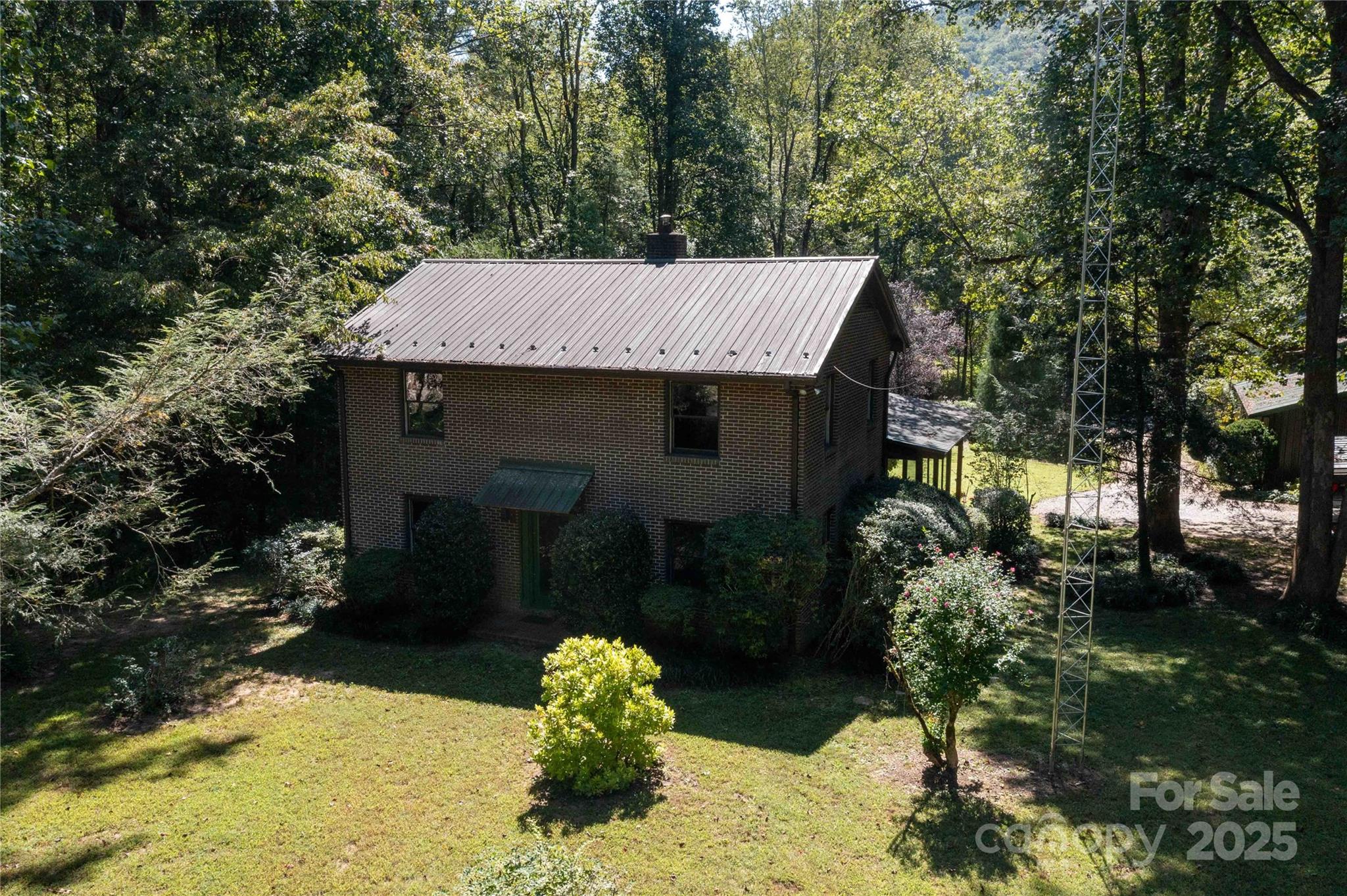 7825 Buck Creek Road Marion, NC 28752 - Photo 39 of 48 a view of a house with a yard and tree s