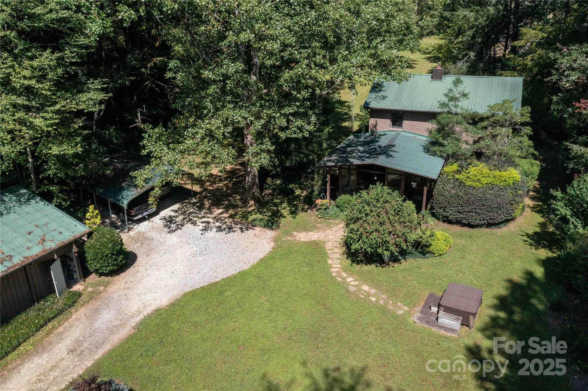 7825 Buck Creek Road Marion, NC 28752 - Photo 5 of 48 an aerial view of a house with a yard