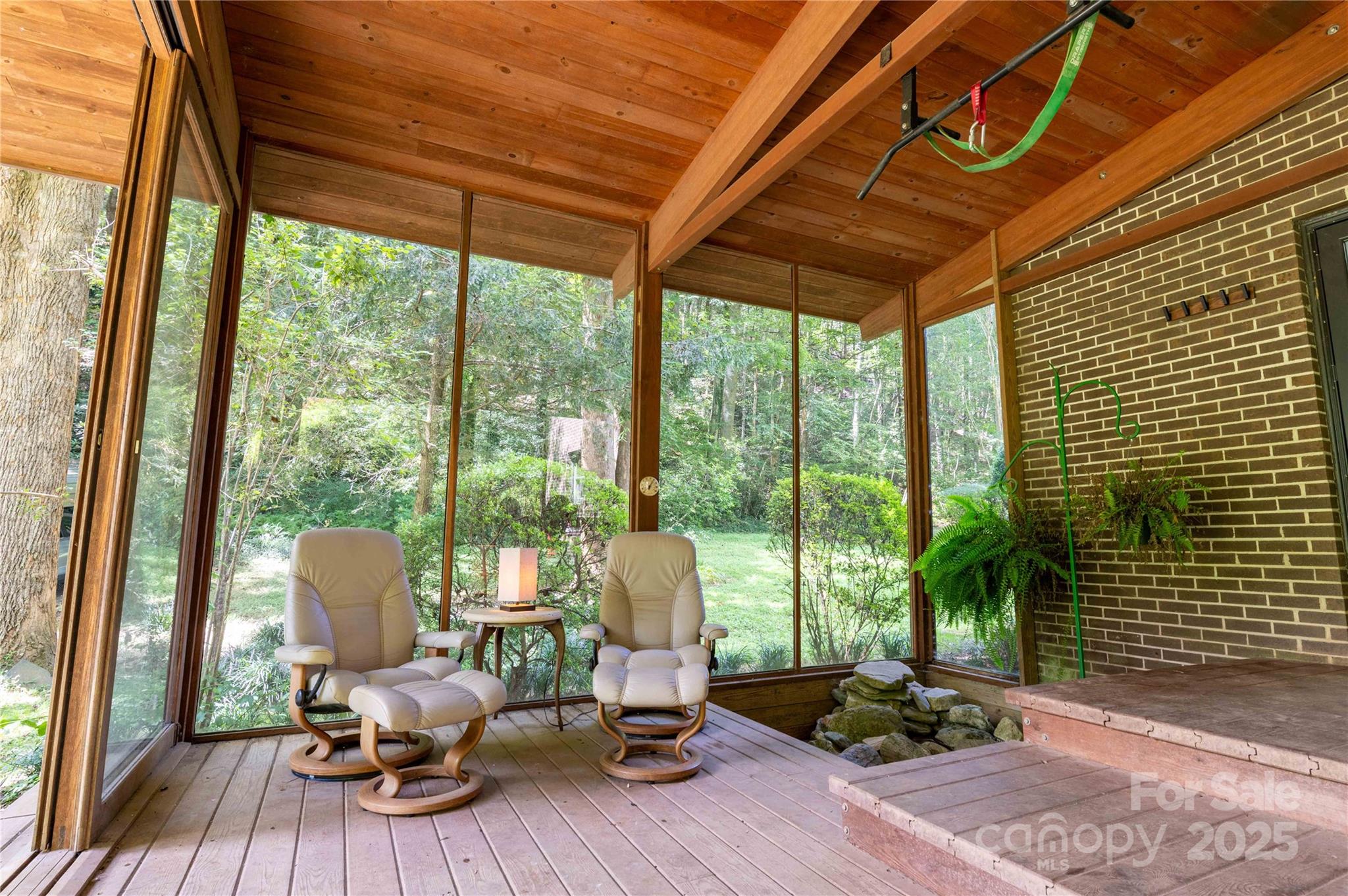 7825 Buck Creek Road Marion, NC 28752 - Photo 7 of 48 a living room with furniture and floor to ceiling windows