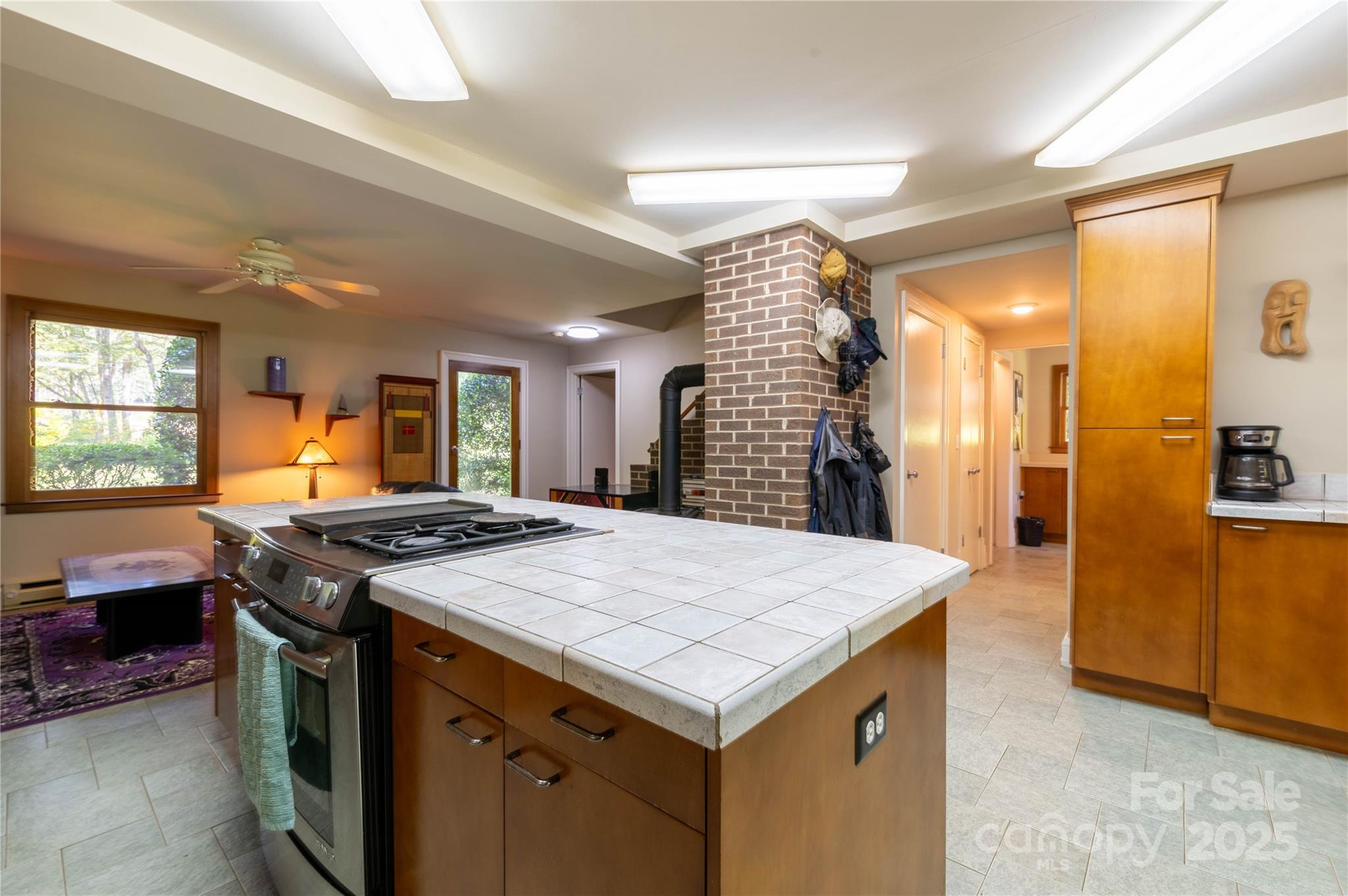 7825 Buck Creek Road Marion, NC 28752 - Photo 8 of 48 a kitchen that has a stove a sink and a refrigerator
