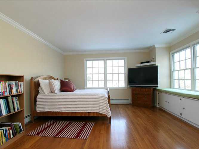152 Lockwood Road Riverside, CT 06878 - Photo 11 of 12 a bedroom with a bed and furniture