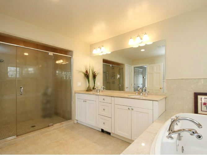 152 Lockwood Road Riverside, CT 06878 - Photo 7 of 12 a spacious bathroom with a shower sink and mirror