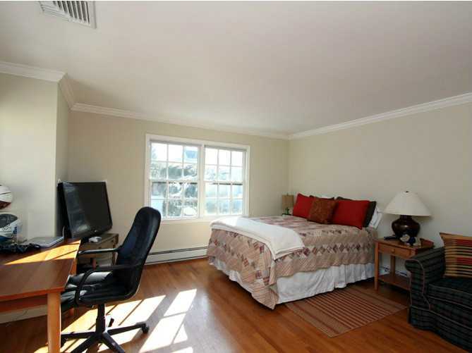 152 Lockwood Road Riverside, CT 06878 - Photo 10 of 12 a bedroom with a bed and a window