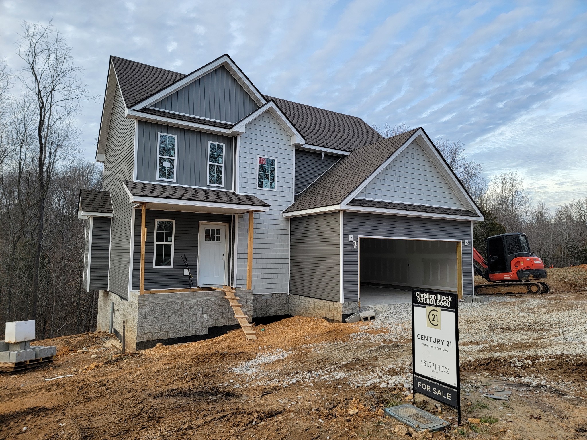 2275 Mockingbird Hill Road Palmyra, TN 37142 - Photo 1 of 18 a front view of a house with garage