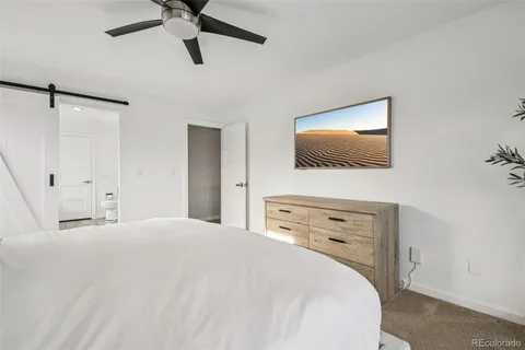 a spacious bathroom with a double vanity sink a mirror and a bathtub