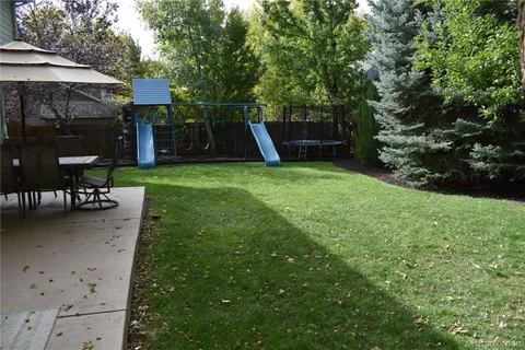 a view of a couches in backyard of house