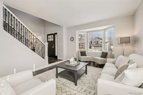 a living room with furniture and a table