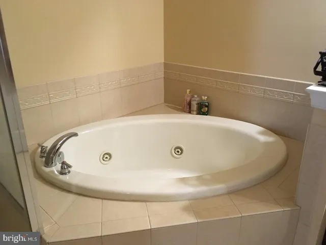 a bath tub sitting in a bathroom