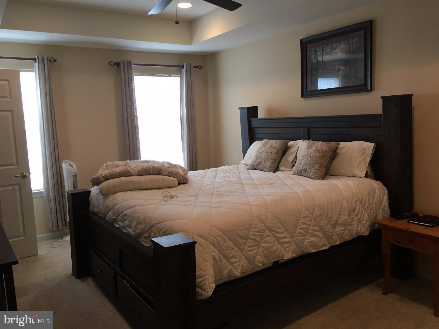 233 Flagstone Road, Unit 5 Chester Springs, PA 19425 - Photo 10 of 12 a bedroom with a bed and window
