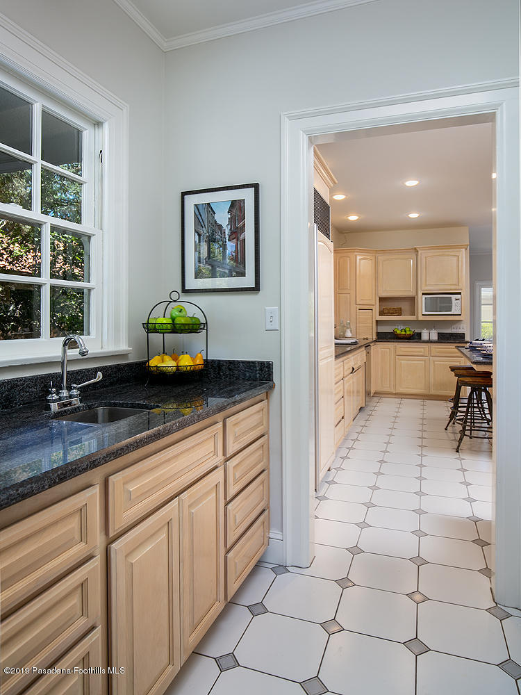 820 Arden Road Pasadena, CA 91106 - Photo 14 of 75 a kitchen with stainless steel appliances granite countertop a sink and a white cabinets
