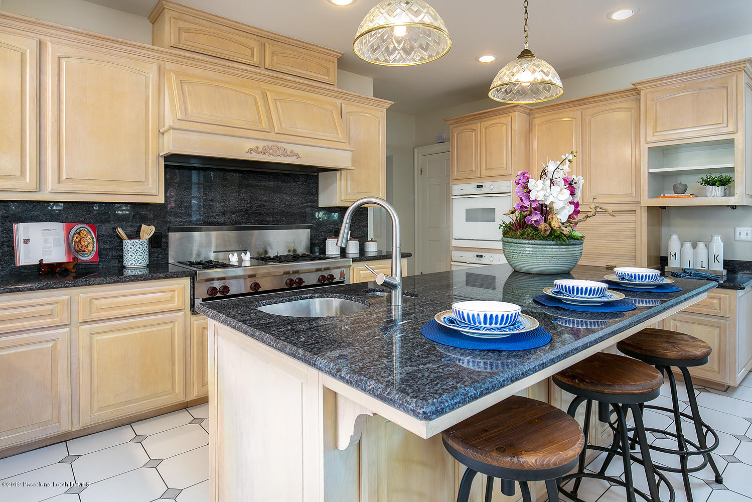 820 Arden Road Pasadena, CA 91106 - Photo 17 of 75 a kitchen with stainless steel appliances granite countertop a sink dishwasher and a stove with wooden floor