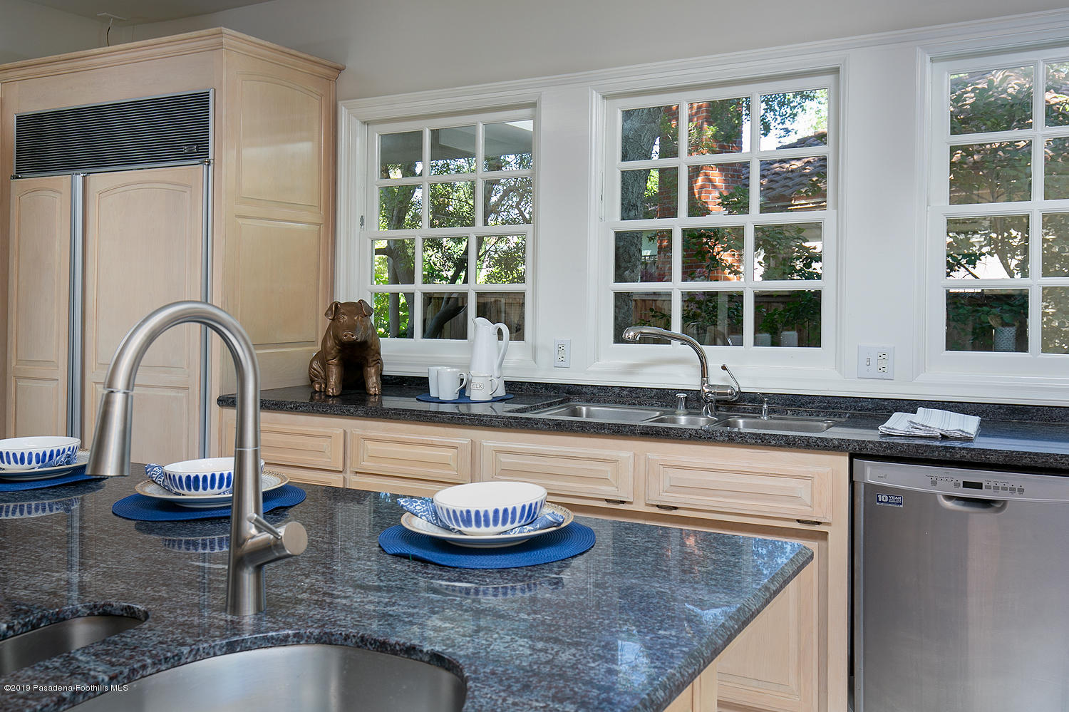 820 Arden Road Pasadena, CA 91106 - Photo 19 of 75 a kitchen with granite countertop a sink and a counter top space