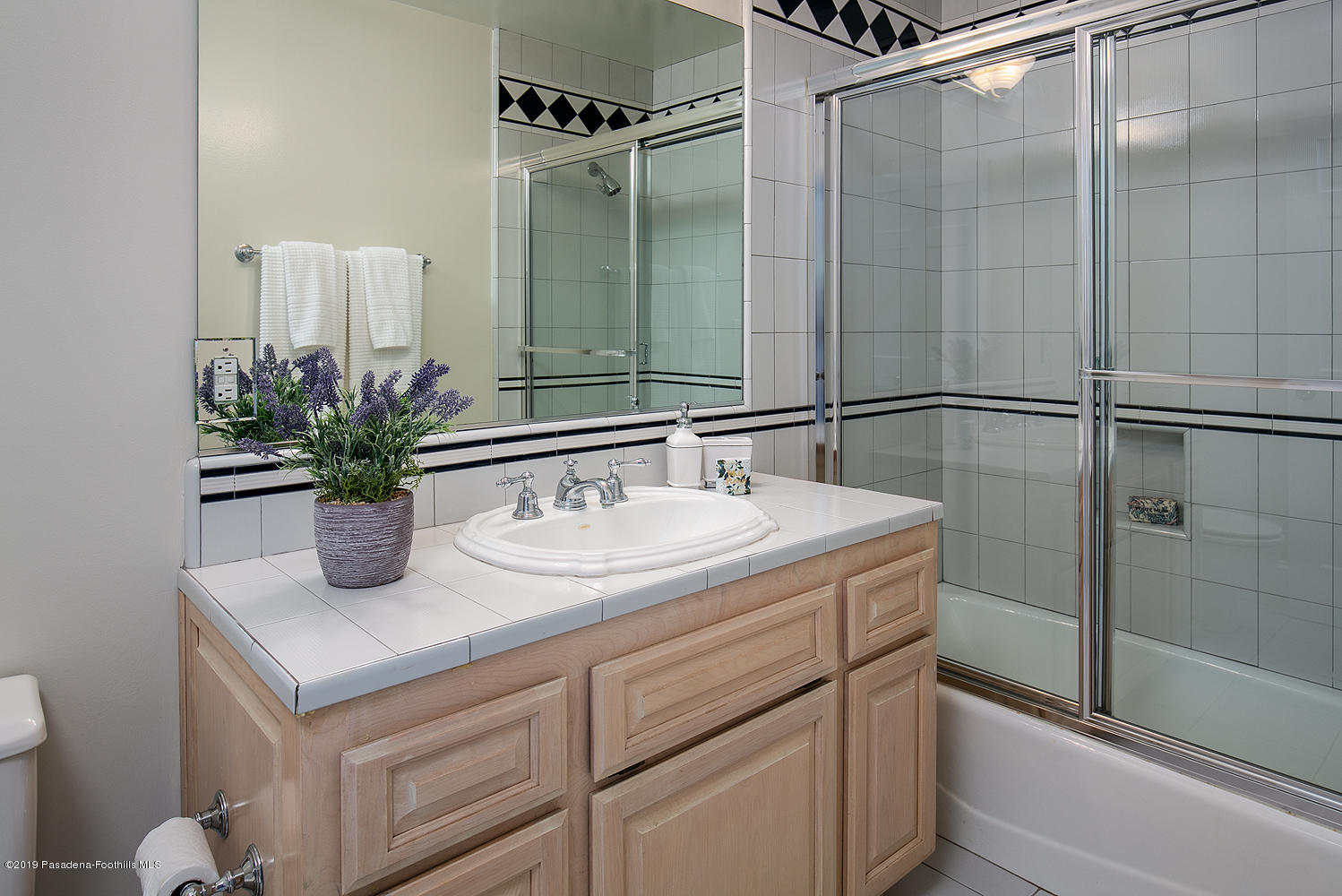 820 Arden Road Pasadena, CA 91106 - Photo 30 of 75 a bathroom with a sink and a mirror