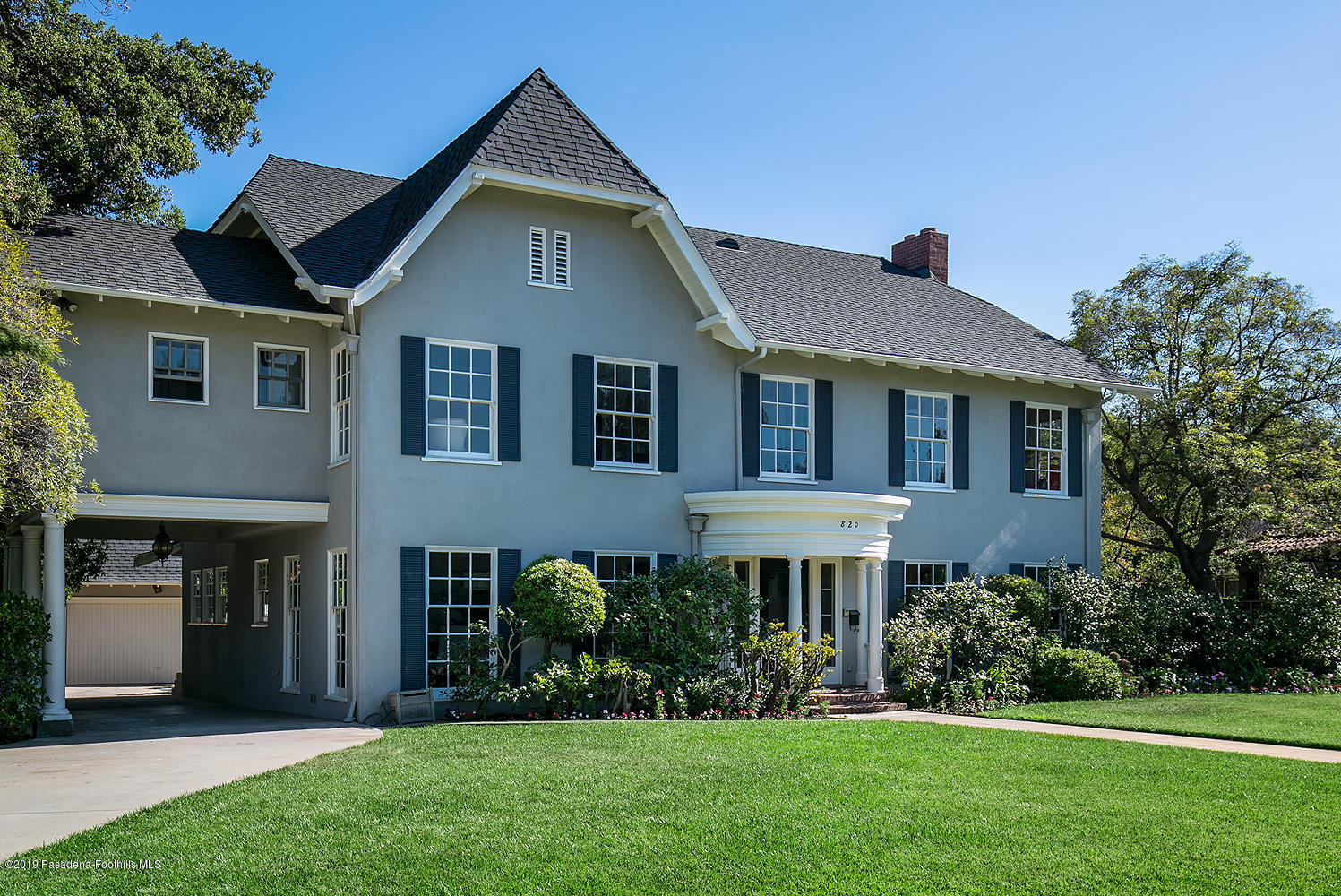 820 Arden Road Pasadena, CA 91106 - Photo 4 of 75 a front view of a house with a yard and trees