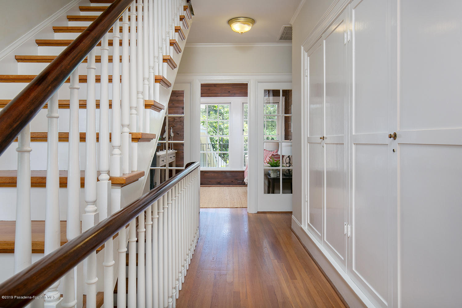 820 Arden Road Pasadena, CA 91106 - Photo 31 of 75 a view of a hallway with wooden floor and entryway